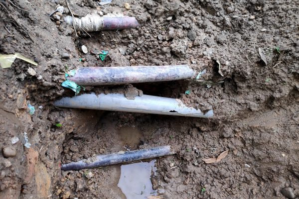 Broken,Or,Damage,Pvc,Pipe,On,The,Mud,Ground.
