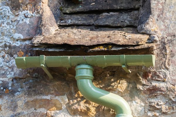 Detail,Of,A,Gutter,At,An,Old,Stone,Cottage,In